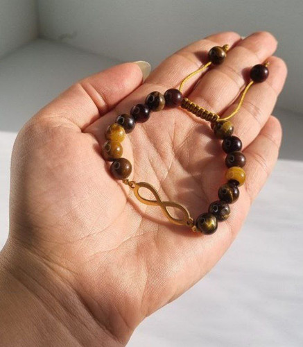 دستبند پلاک بینهایت و سنگ چشم ببر